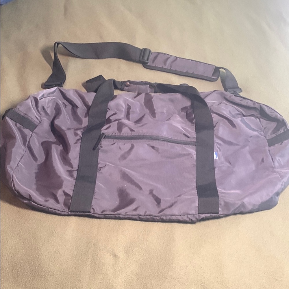 Dark gray and black nylon duffel bag. Approximately 27” x 15” x 11 1/2”